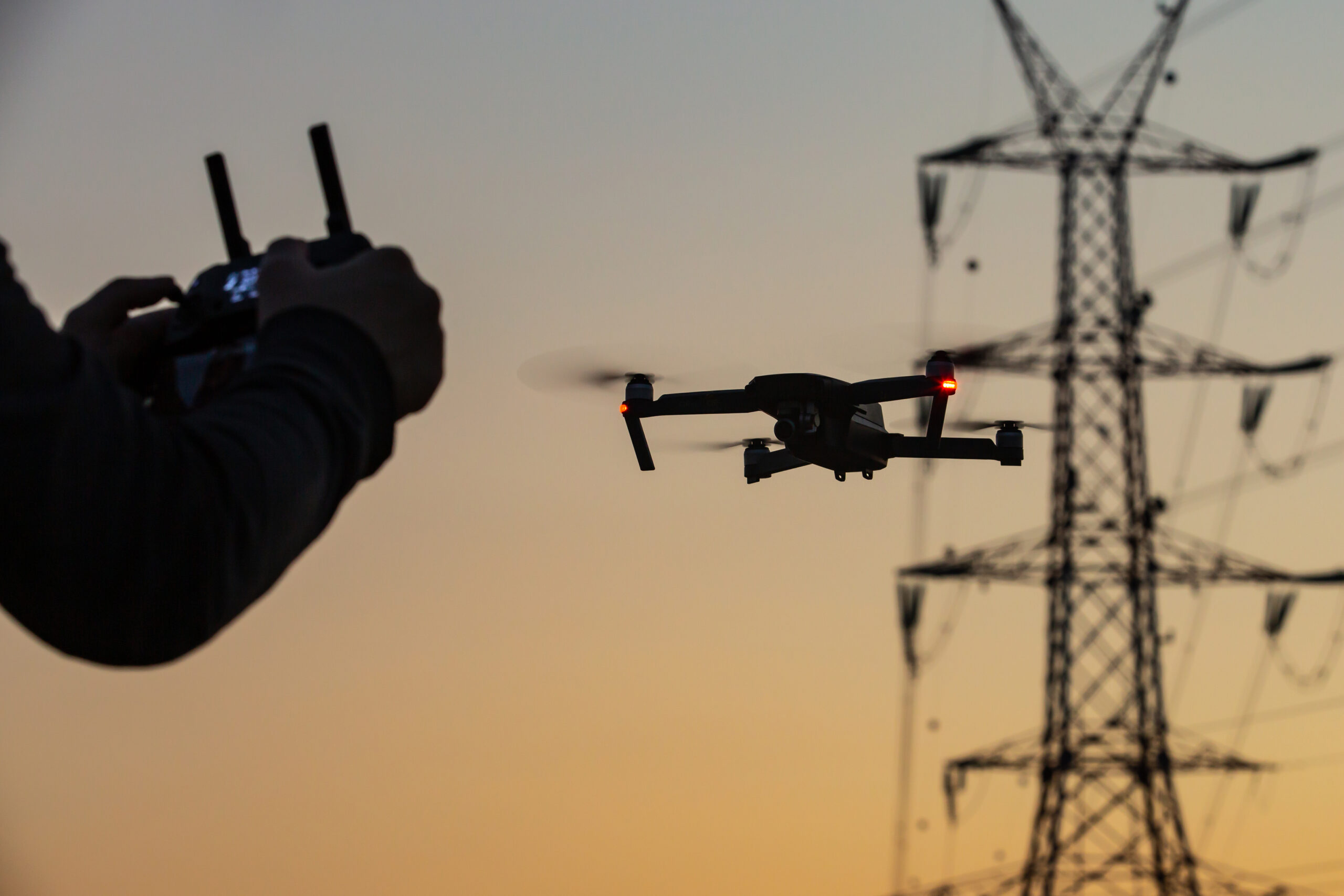 low-angle-view-person-photographing-against-sky-sunset